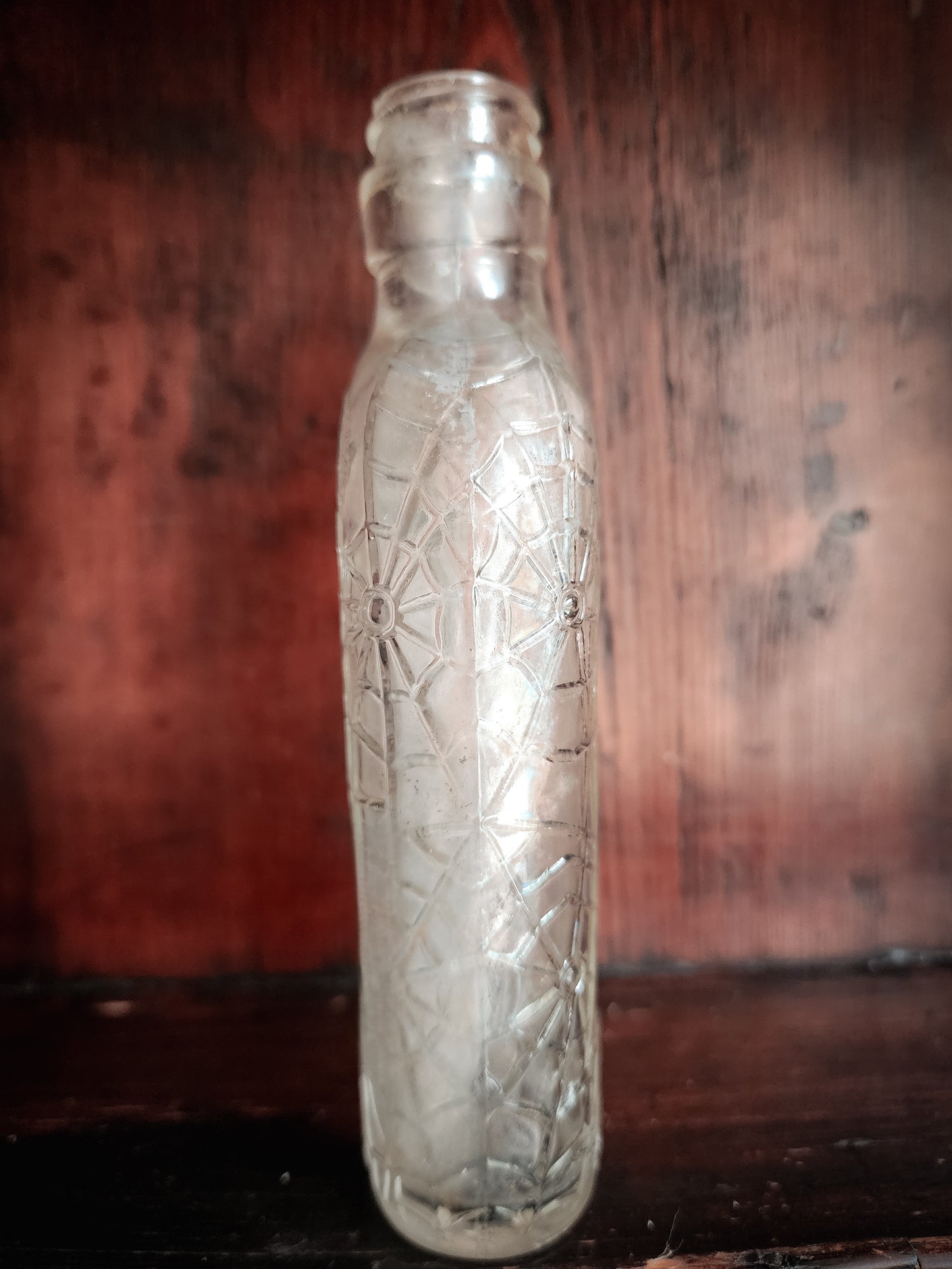 Antique Spiderweb Embossed Glass Bottle