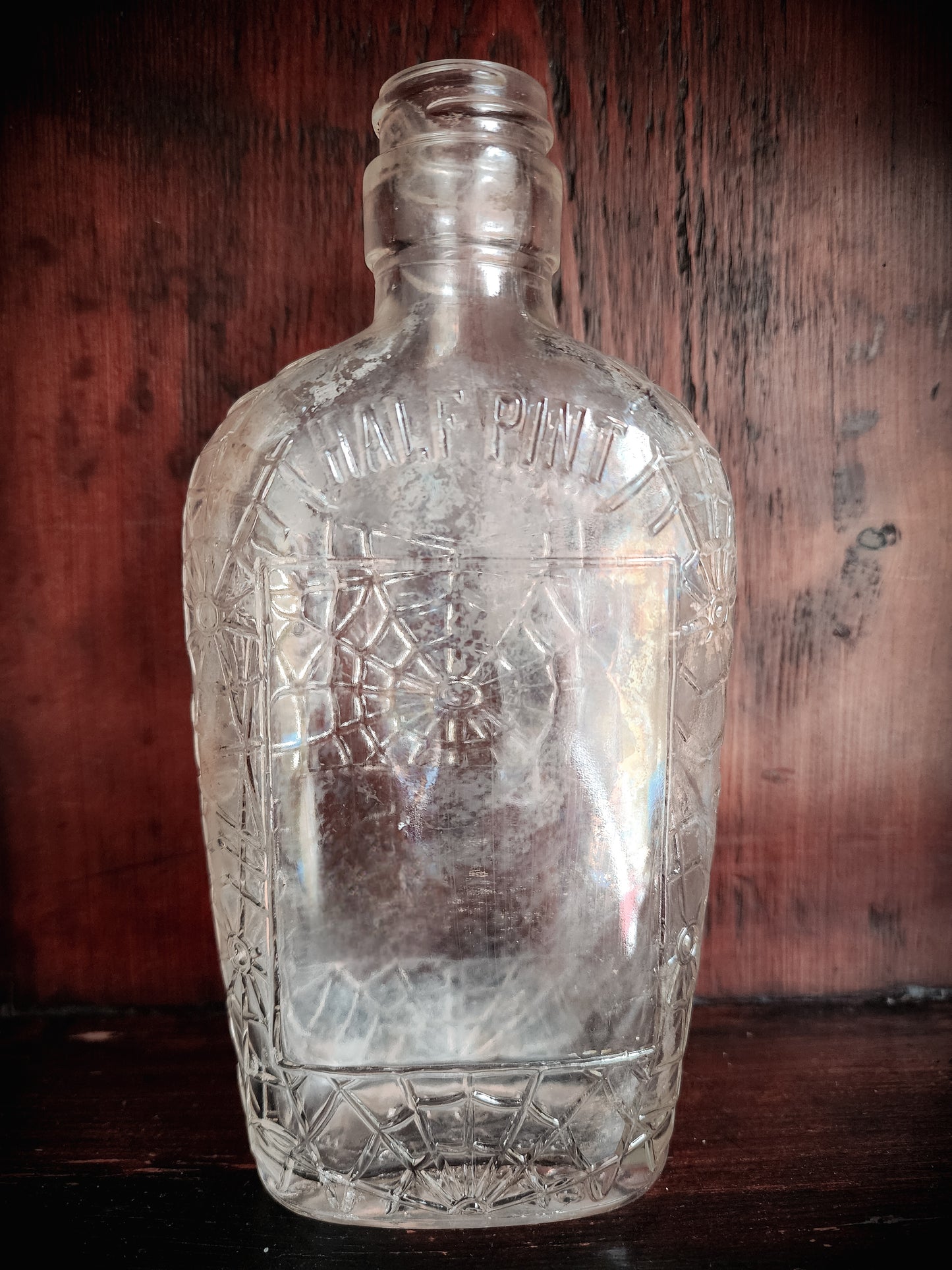 Antique Spiderweb Embossed Glass Bottle