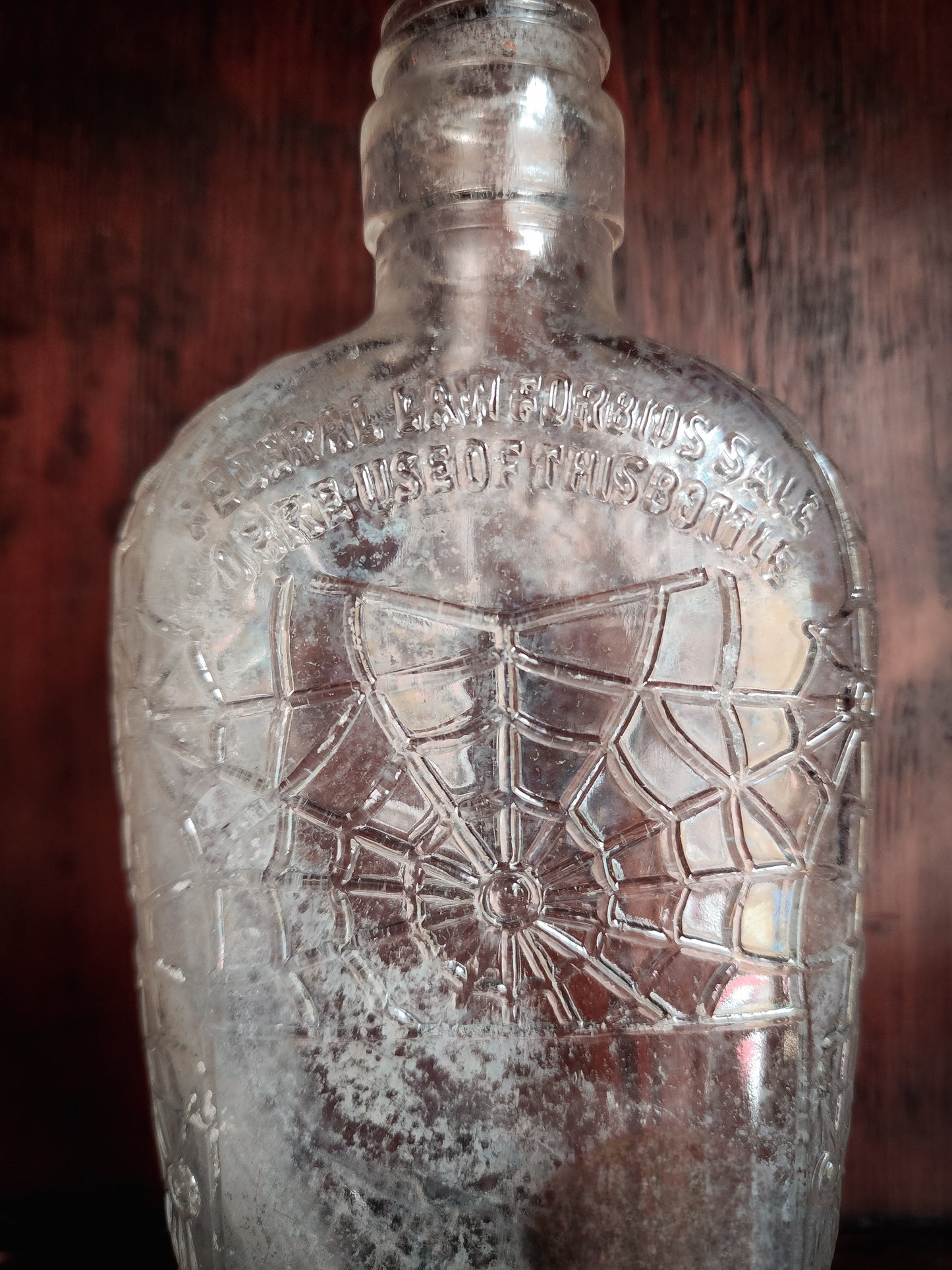 Antique Spiderweb Embossed Glass Bottle