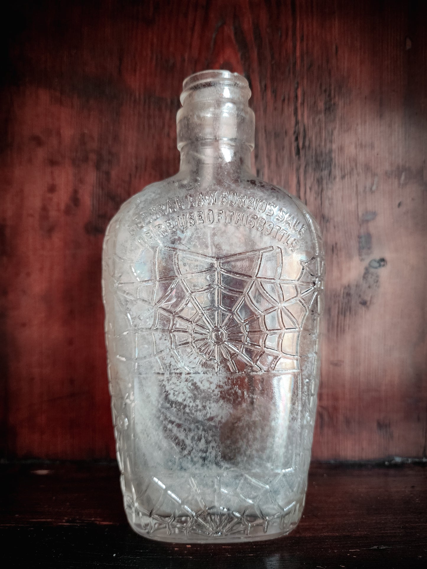 Antique Spiderweb Embossed Glass Bottle